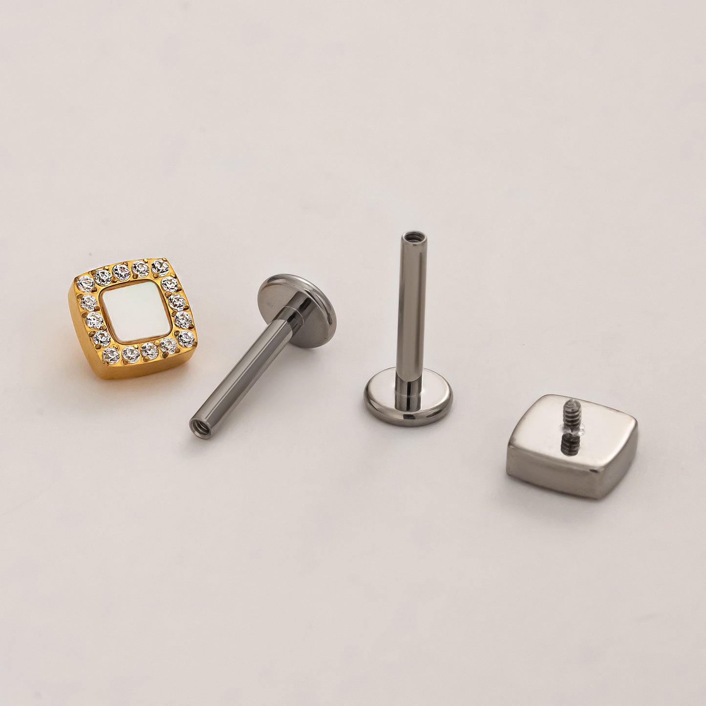 Front and back view of lumi square titanium flat back earrings with implant-grade titanium threaded posts