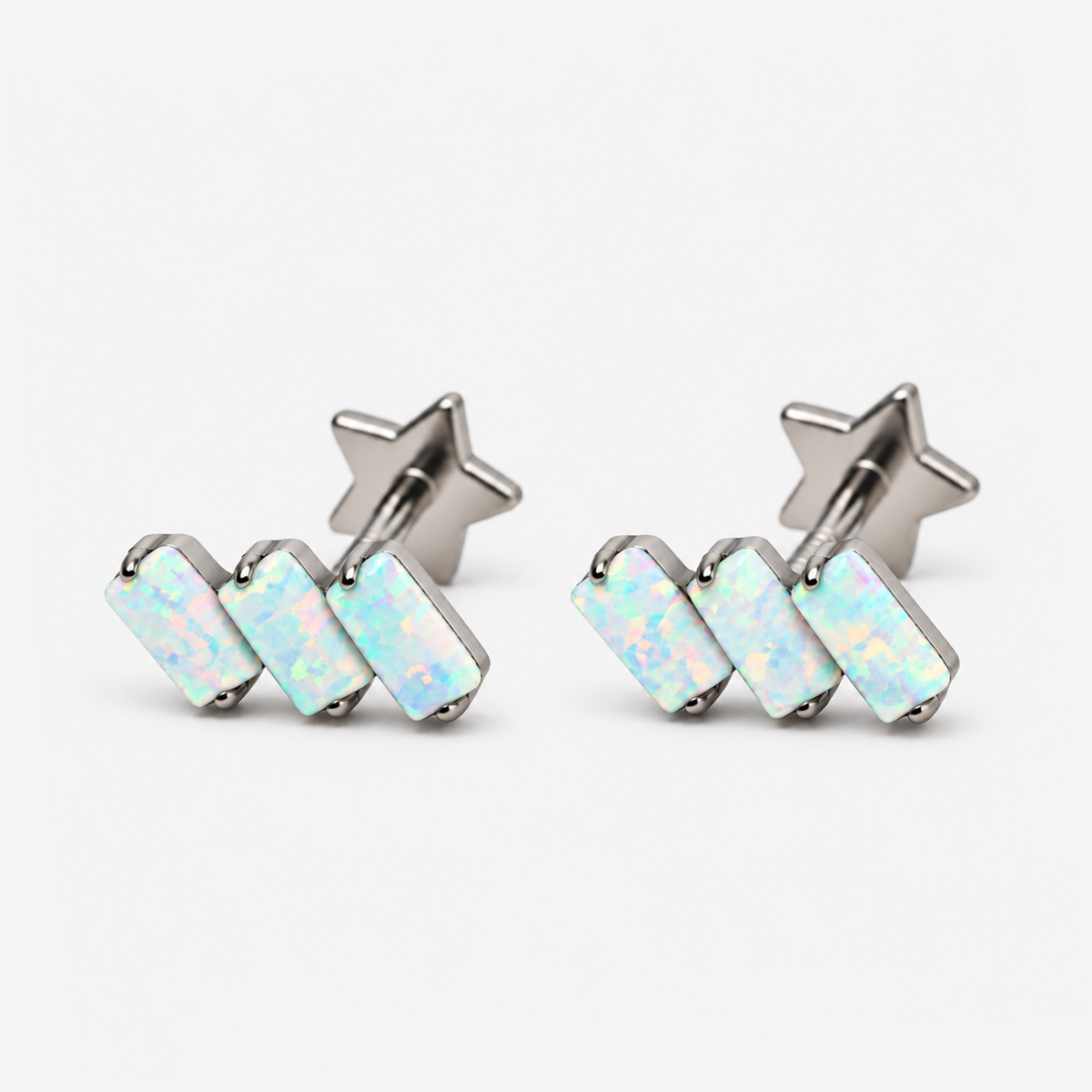 Two Opal Steps titanium flat back earrings with rectangular opals and star-shaped backs, supplementary view
