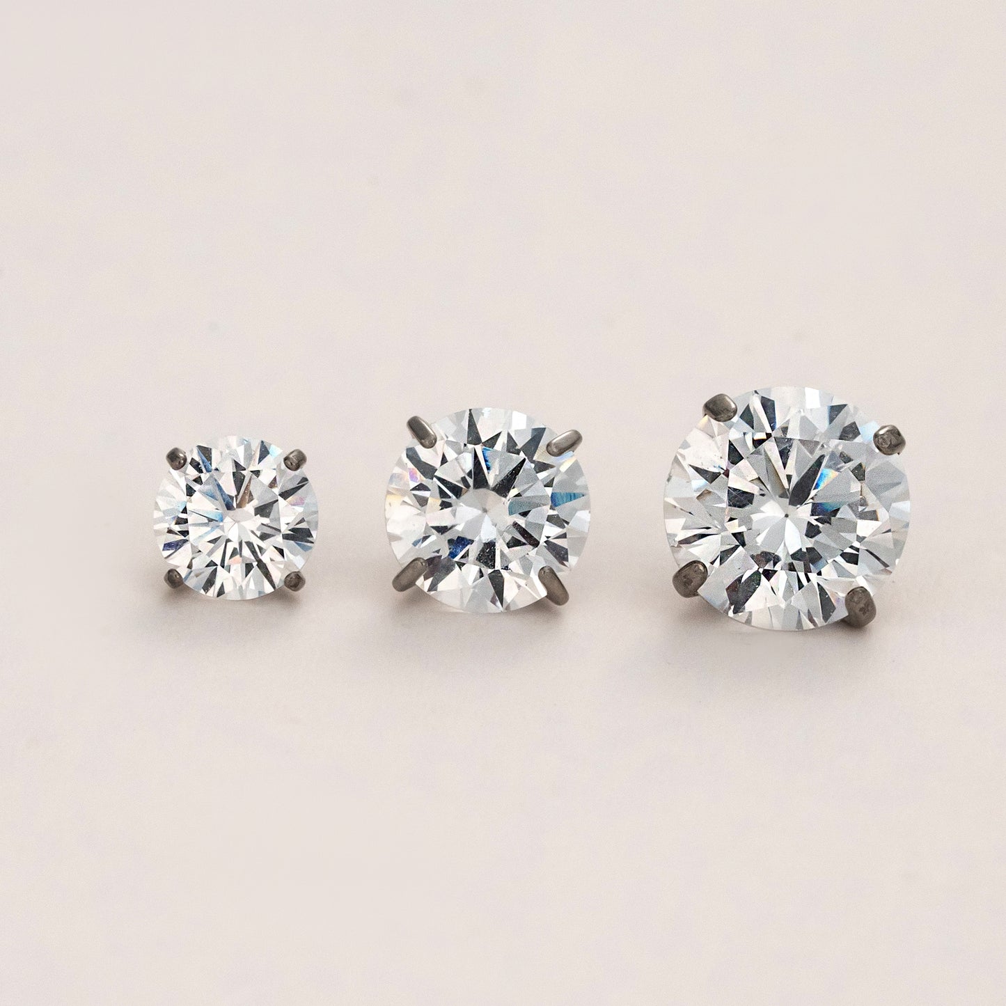 Set of timeless radiance titanium flat back stud earrings in multiple sizes, hypoallergenic and safe for sensitive ears