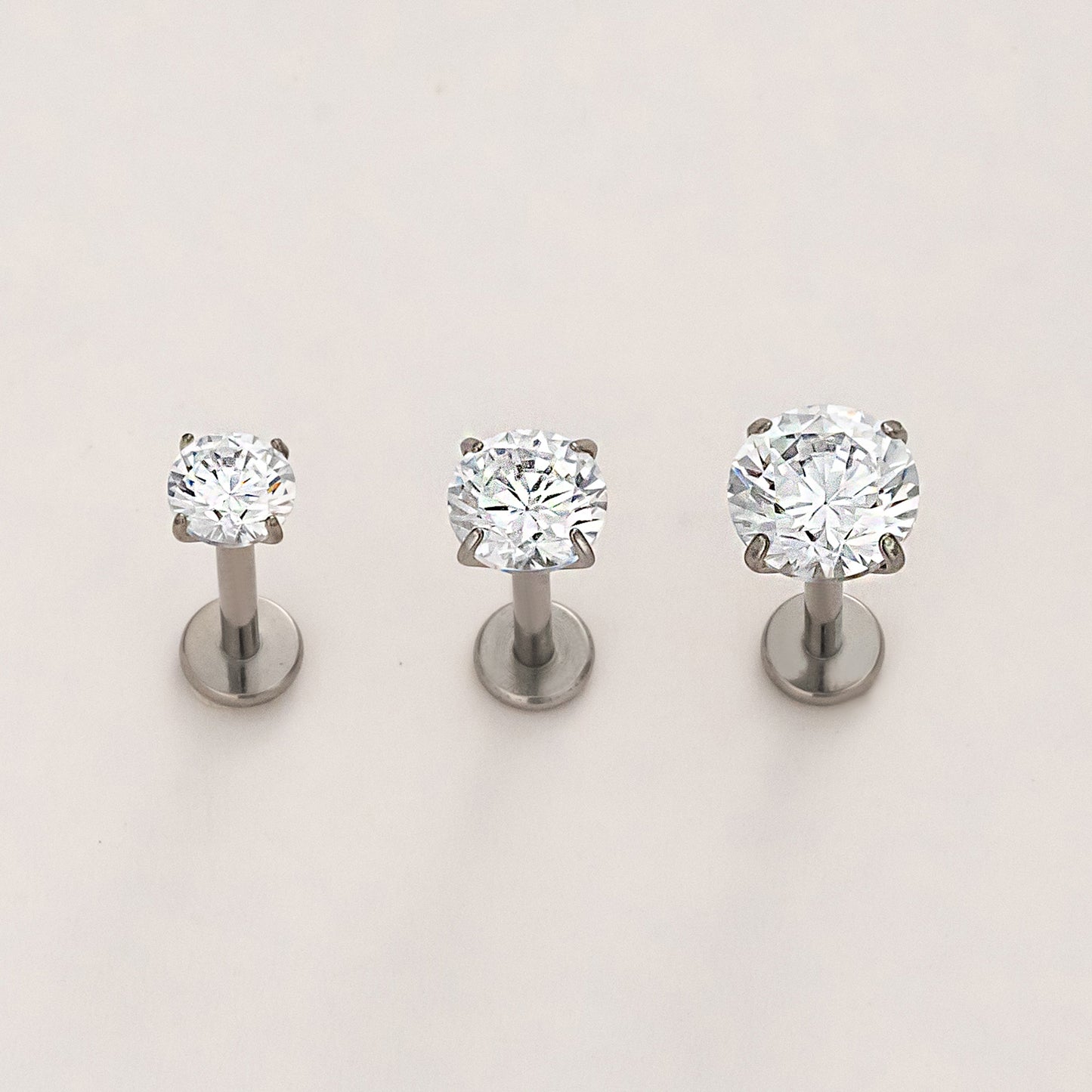 Titanium timeless radiance flat back stud earrings in natural titanium with classic round crystal center, hypoallergenic and safe for sensitive ears