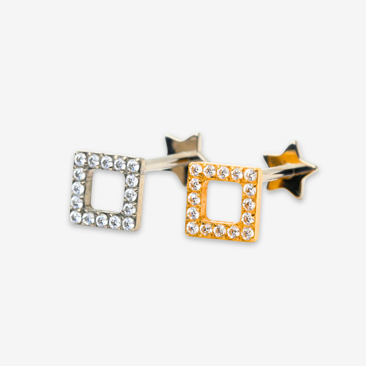 Titanium Spark Frame internally threaded flat back stud earrings in natural titanium and gold, featuring a crystal-lined square frame with a small star attached to the earring post. Hypoallergenic implant-grade titanium earrings on a white background.