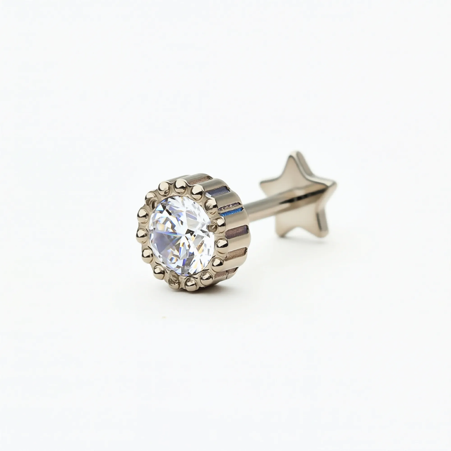 Angled front view of the Titanium Crown Spark internally threaded flat back stud earring in natural titanium, featuring a round crystal in a crown-style setting. Hypoallergenic implant-grade titanium.