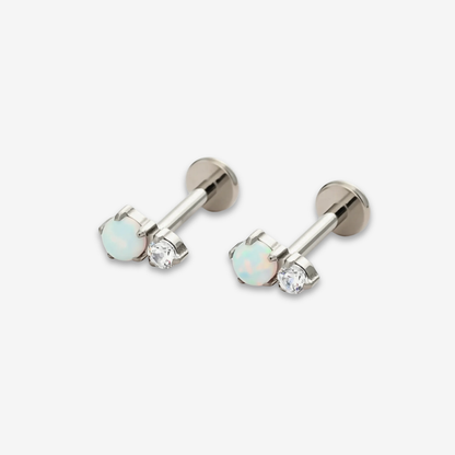 Titanium Twin Moonlight Opal internally threaded flat back stud earrings featuring a white opal stone paired with a clear crystal. Front view showing hypoallergenic implant-grade titanium design.