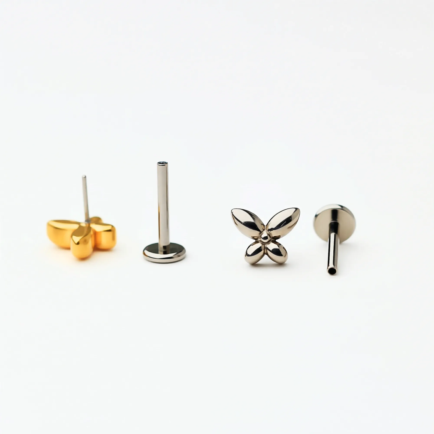 Back and side view of Titanium Petite Butterfly flat back stud earrings in natural titanium and gold. Shows the smooth flat back base and implant-grade titanium push-in posts, hypoallergenic and safe for sensitive ears.