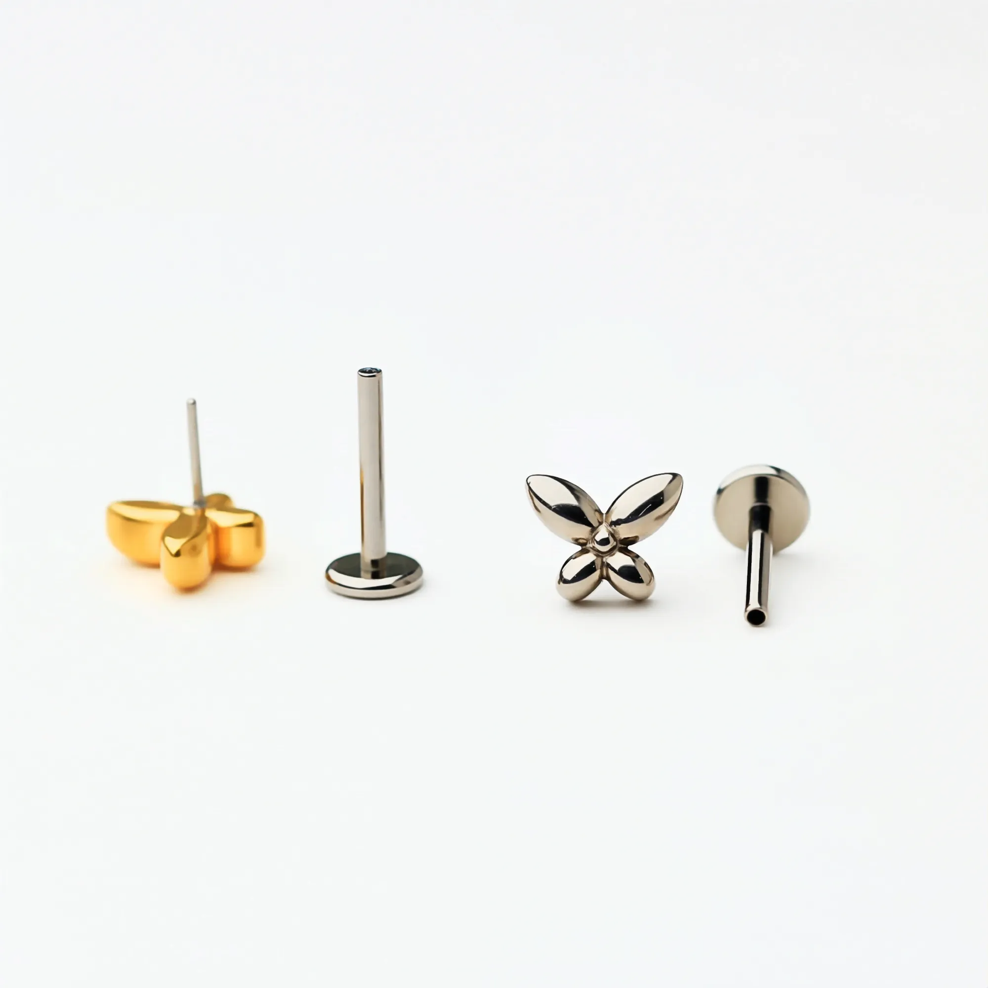 Back and side view of Titanium Petite Butterfly flat back stud earrings in natural titanium and gold. Shows the smooth flat back base and implant-grade titanium push-in posts, hypoallergenic and safe for sensitive ears.