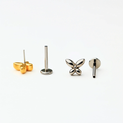 Back and side view of Titanium Petite Butterfly flat back stud earrings in natural titanium and gold. Shows the smooth flat back base and implant-grade titanium push-in posts, hypoallergenic and safe for sensitive ears.