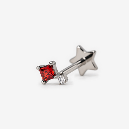 Candy Pop titanium flat back earring with red stone, angled view
