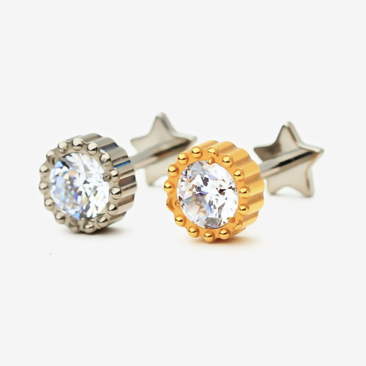 Crown Spark flat back stud earrings in titanium and gold.