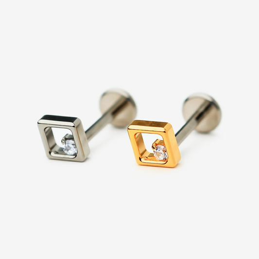 Floating Crystal flat back stud earrings in titanium and gold.