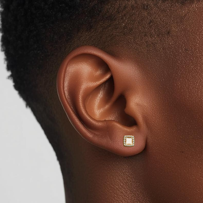 Model wearing the Lumi Square internally threaded flat back stud earring in natural titanium, showing the square crystal bezel and comfortable implant-grade titanium flat back fit.