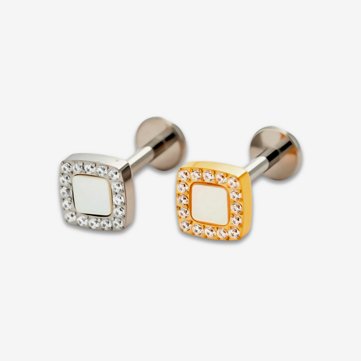Lumi Square flat back stud earrings in titanium and gold.