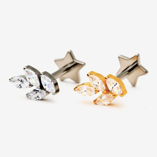 Mini Leaf flat back stud earrings in titanium and gold.