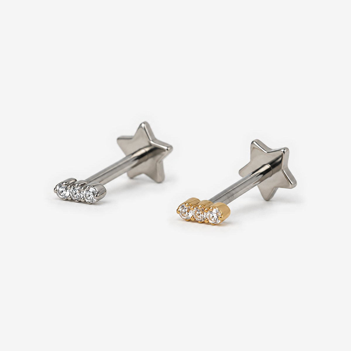 Mini Trio flat back earrings in titanium and gold, front angled view