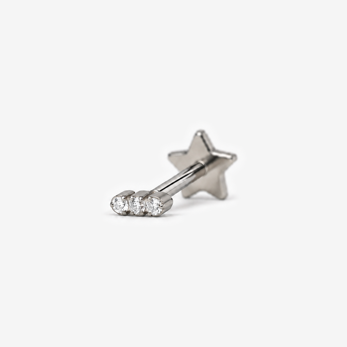 Mini Trio flat back earring in titanium, angled view