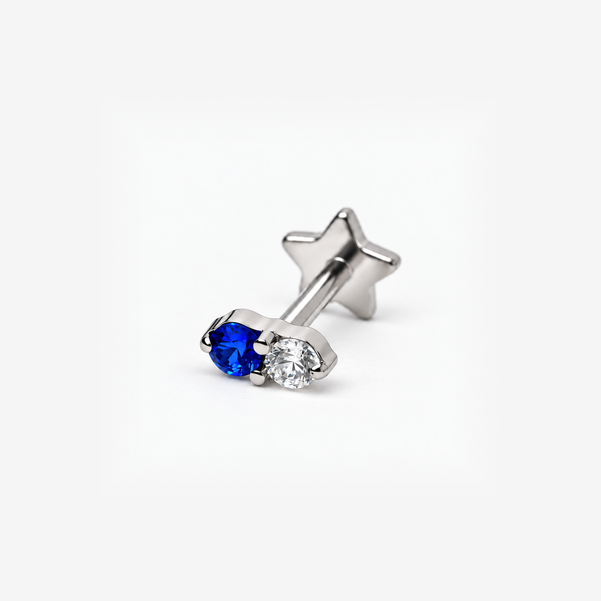 Moonlit blue and clear CZ titanium flat back earring, angled view