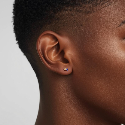Moonlit blue and clear CZ earring worn on the earlobe