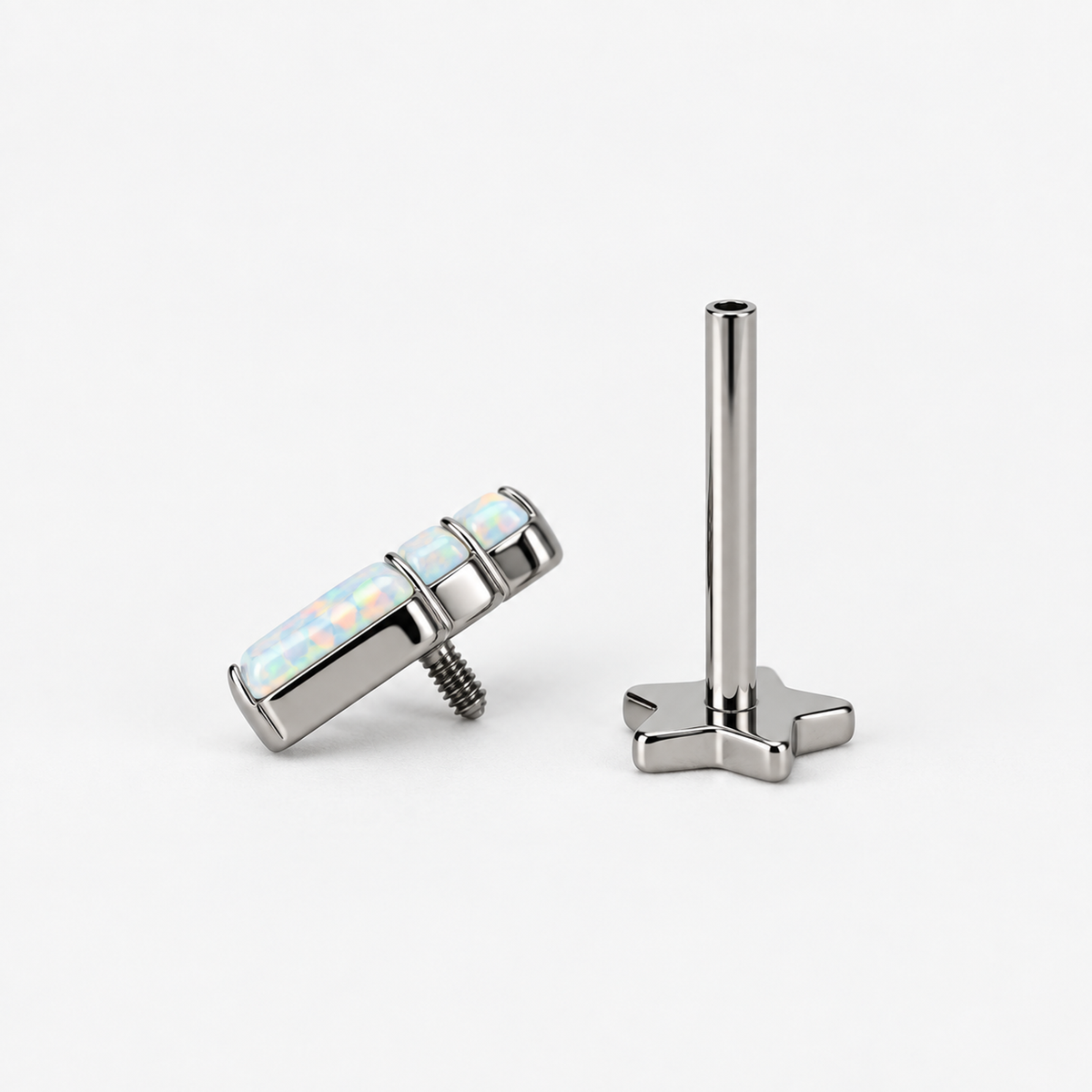 Opal Steps titanium earring with the three-opal decorative top separated from its internally threaded star-back post
