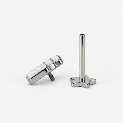 Opal Steps titanium earring with the three-opal decorative top separated from its internally threaded star-back post