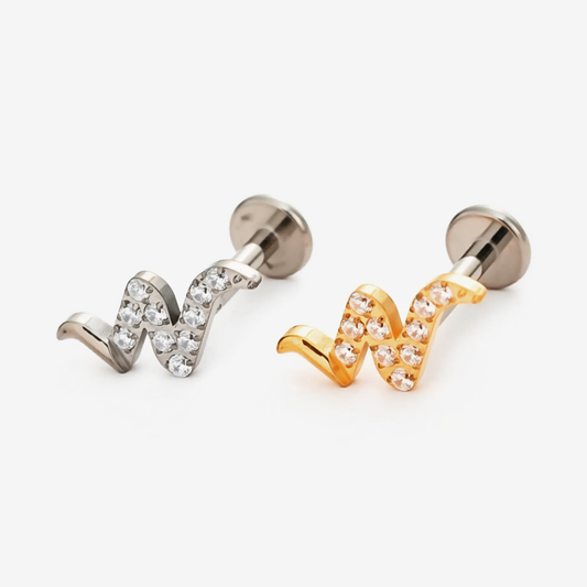 Snaked Wave flat back stud earrings in titanium and gold.