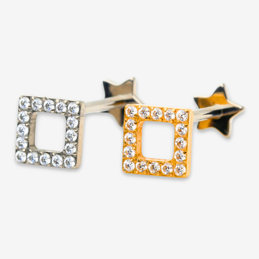 Spark Frame flat back stud earrings in titanium and gold.