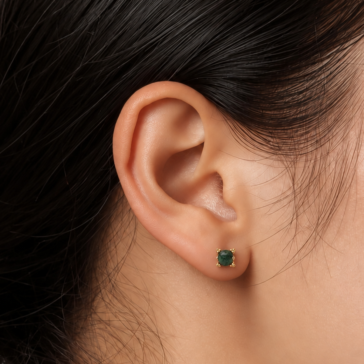 Vintage Gem gold-plated titanium earring worn on the earlobe